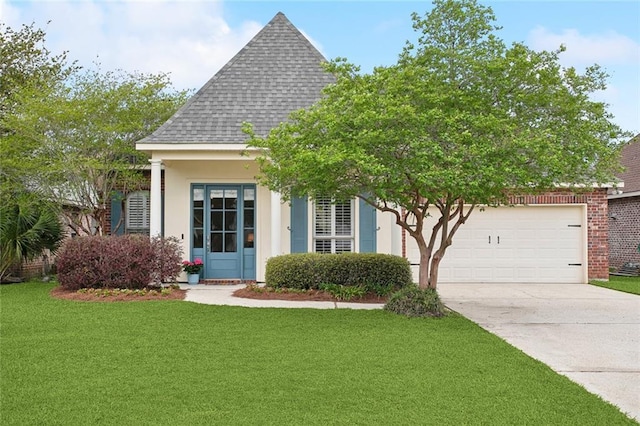 2424 Cours Carson St, Mandeville, LA 70448 - view of front facade with a garage, concrete driveway, a front yard, a shingled roof, and stucco siding