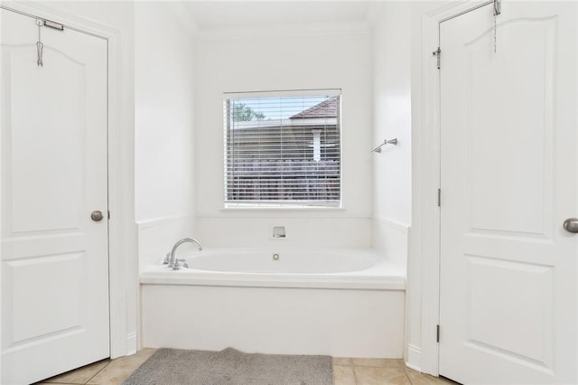 2424 Cours Carson St, Mandeville, LA 70448 - bathroom featuring tile patterned flooring, a bath, and ornamental molding