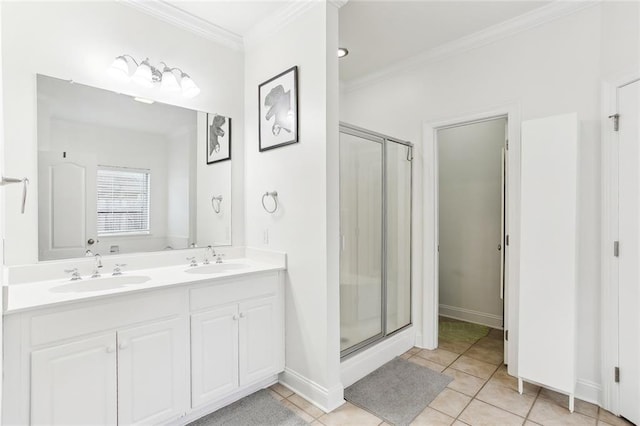 2424 Cours Carson St, Mandeville, LA 70448 - full bath featuring crown molding, a stall shower, double vanity, baseboards, and tile patterned floors