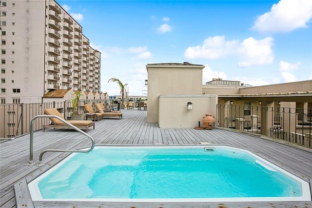 330 Julia St Unit 223, New Orleans, LA 70130 - view of swimming pool with a deck