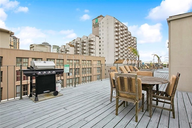 330 Julia St Unit 223, New Orleans, LA 70130 - wooden terrace with a grill