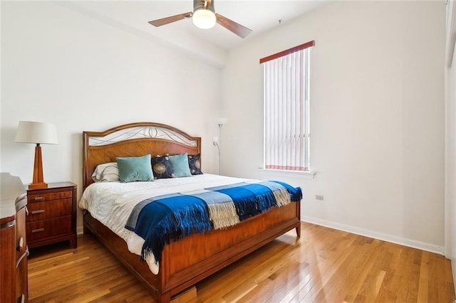 330 Julia St Unit 223, New Orleans, LA 70130 - bedroom with light wood finished floors and a ceiling fan