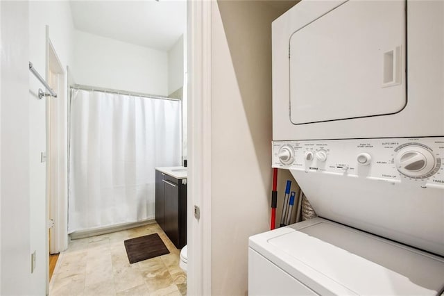 330 Julia St Unit 223, New Orleans, LA 70130 - laundry area featuring estacked washer and dryer