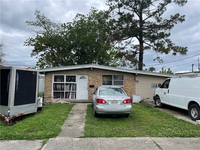 2007 Georgia Ave, Kenner, LA 70062 - view of front facade featuring brick siding and a front lawn
