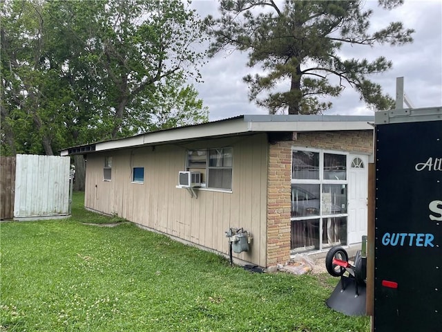 2007 Georgia Ave, Kenner, LA 70062 - view of home's exterior with fence, cooling unit, and a lawn