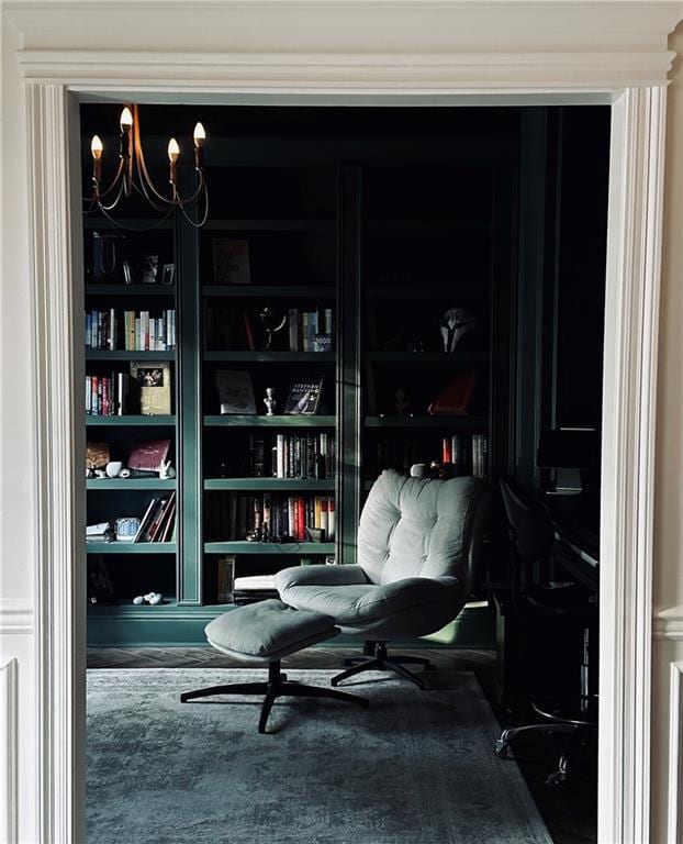 living area with a chandelier