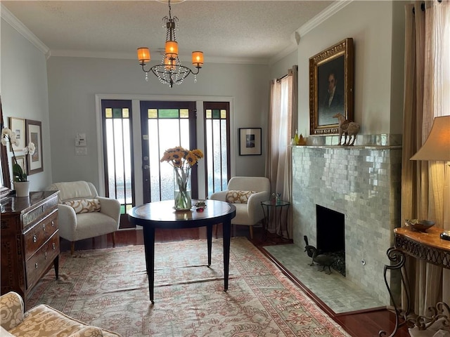 820 Solomon Pl, New Orleans, LA 70119 - living room featuring ornamental molding, wood finished floors, a chandelier, a premium fireplace, and a textured ceiling