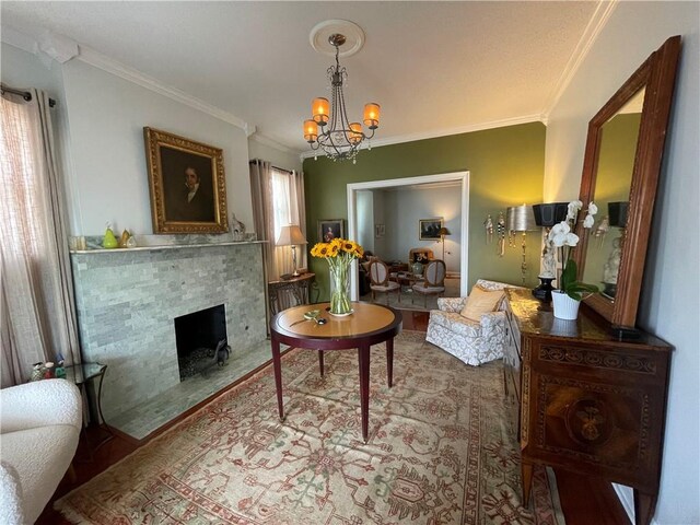 820 Solomon Pl, New Orleans, LA 70119 - living area featuring ornamental molding, a chandelier, a fireplace with flush hearth, and wood finished floors