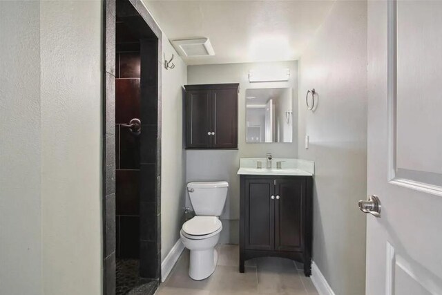 820 Solomon Pl, New Orleans, LA 70119 - full bathroom featuring toilet, vanity, tile patterned flooring, and baseboards