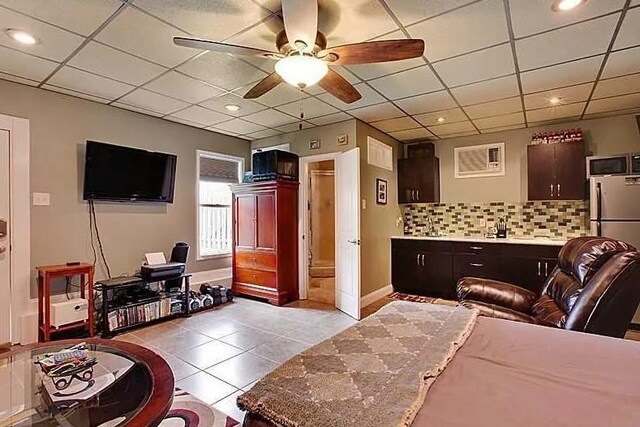 820 Solomon Pl, New Orleans, LA 70119 - living area with light tile patterned floors, ceiling fan, a drop ceiling, baseboards, and recessed lighting