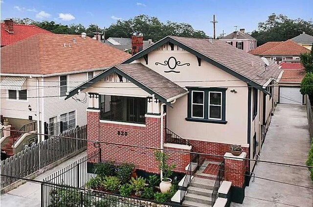 820 Solomon Pl, New Orleans, LA 70119 - view of front of home with brick siding and a shingled roof