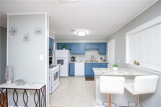 kitchen with light tile patterned floors, white appliances, ornamental molding, blue cabinets, and a sink