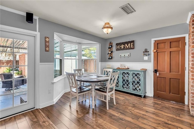 621 Gordon Ave, Harahan, LA 70123 - dining area with wainscoting, wood finished floors, and visible vents
