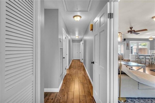 621 Gordon Ave, Harahan, LA 70123 - hall featuring hardwood / wood-style floors, attic access, and baseboards