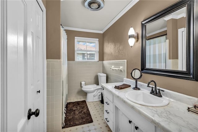 621 Gordon Ave, Harahan, LA 70123 - bathroom with toilet, tile walls, wainscoting, crown molding, and vanity