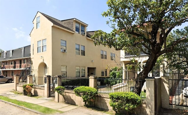 212327 Carondelet St, New Orleans, LA 70130 - view of property with a fenced front yard