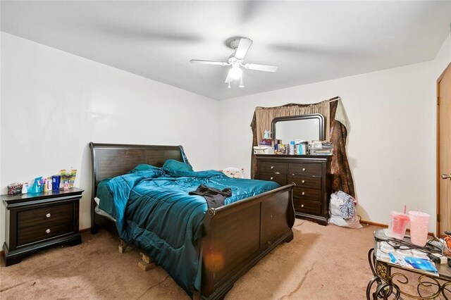 2205 Giuffrias Ave, Metairie, LA 70001 - bedroom featuring ceiling fan, light colored carpet, and baseboards