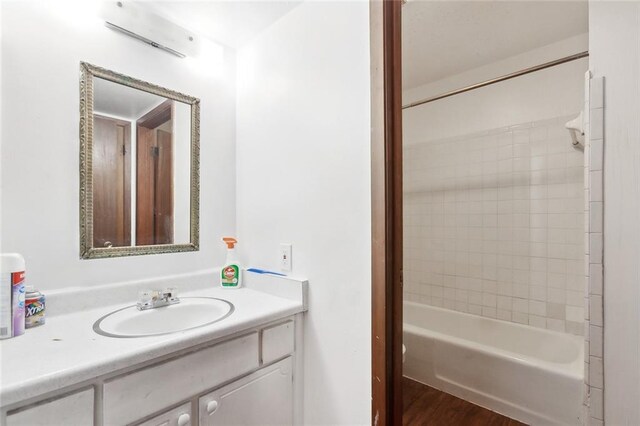 2205 Giuffrias Ave, Metairie, LA 70001 - bathroom with bathtub / shower combination, vanity, and wood finished floors