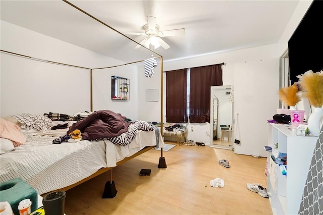2205 Giuffrias Ave, Metairie, LA 70001 - bedroom featuring light wood-style flooring and ceiling fan