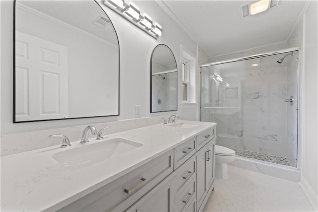 full bath featuring crown molding, toilet, a marble finish shower, and a sink