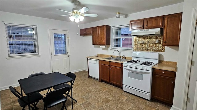 kitchen with white appliances, light countertops, a ceiling fan, under cabinet range hood, and a sink