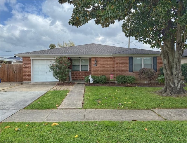 1101 Belmont Pl, Metairie, LA 70001 - ranch-style house with a front yard, an attached garage, fence, concrete driveway, and brick siding