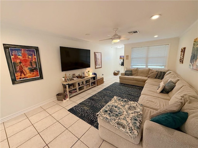 1101 Belmont Pl, Metairie, LA 70001 - living room featuring light tile patterned floors, ceiling fan, ornamental molding, visible vents, and baseboards