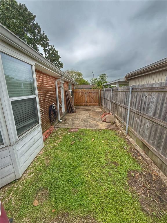 1101 Belmont Pl, Metairie, LA 70001 - view of yard featuring a patio and fence
