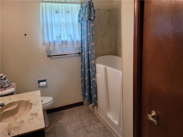 full bath with baseboards, a shower with curtain, toilet, vanity, and tile patterned flooring