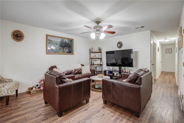3403 W Loyola Dr, Kenner, LA 70065 - living area with visible vents, ceiling fan, wood finished floors, and baseboards
