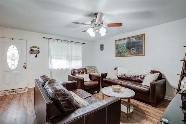 3403 W Loyola Dr, Kenner, LA 70065 - living room featuring wood finished floors, baseboards, a ceiling fan, and a healthy amount of sunlight