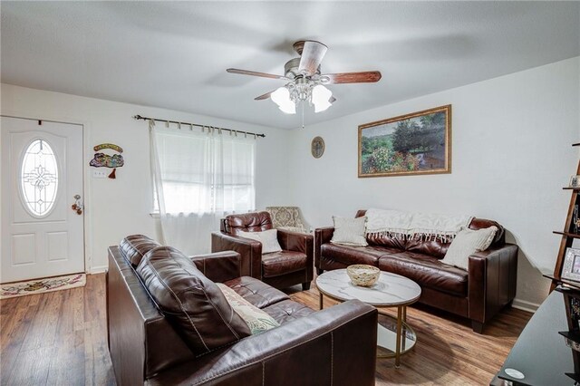 3403 W Loyola Dr, Kenner, LA 70065 - living area featuring wood finished floors, a ceiling fan, and baseboards