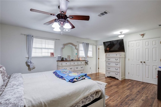 3403 W Loyola Dr, Kenner, LA 70065 - bedroom with a closet, visible vents, ceiling fan, and dark wood finished floors