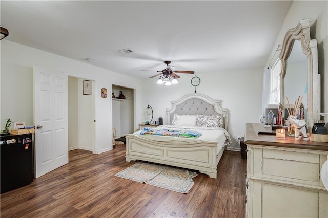 3403 W Loyola Dr, Kenner, LA 70065 - bedroom with dark wood-style flooring, baseboards, and ceiling fan