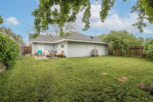 3403 W Loyola Dr, Kenner, LA 70065 - rear view of house featuring a patio area, a fenced backyard, central AC, and a lawn