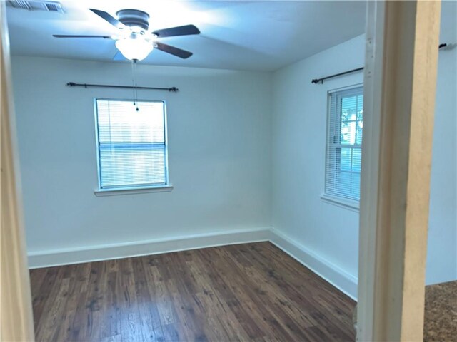 3403 W Loyola Dr, Kenner, LA 70065 - unfurnished room with dark wood-style flooring, baseboards, and ceiling fan