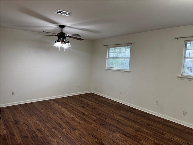 3403 W Loyola Dr, Kenner, LA 70065 - empty room featuring dark wood finished floors, a ceiling fan, and baseboards
