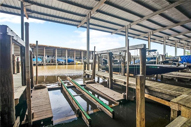32875 Rivergate Cir Unit 28, Springfield, LA 70462 - dock featuring boat lift and a water view