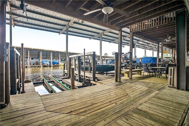 32875 Rivergate Cir Unit 28, Springfield, LA 70462 - dock area featuring boat lift and a water view