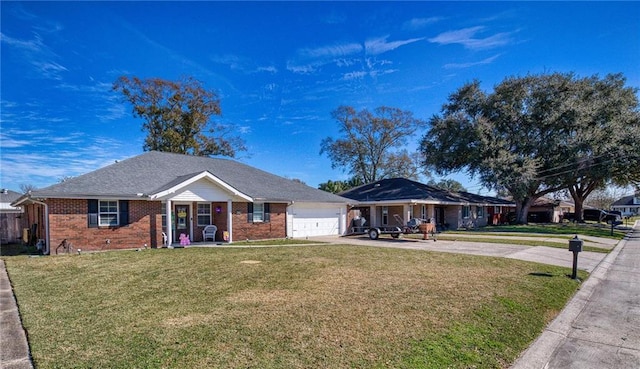 single story home featuring a garage, driveway, a front lawn, and brick siding