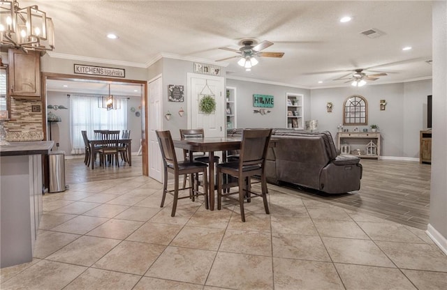 dining area with visible vents, recessed lighting, ceiling fan with notable chandelier, and crown molding