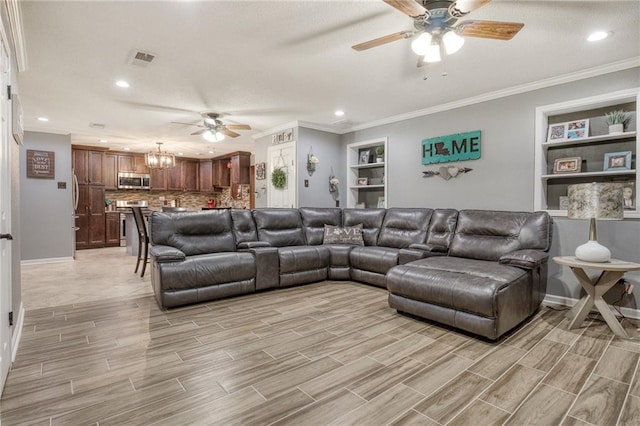 living area with recessed lighting, ceiling fan with notable chandelier, and light wood-style floors
