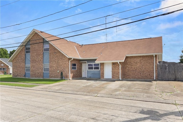 3952 Augusta St, Metairie, LA 70001 - view of front facade featuring brick siding and fence