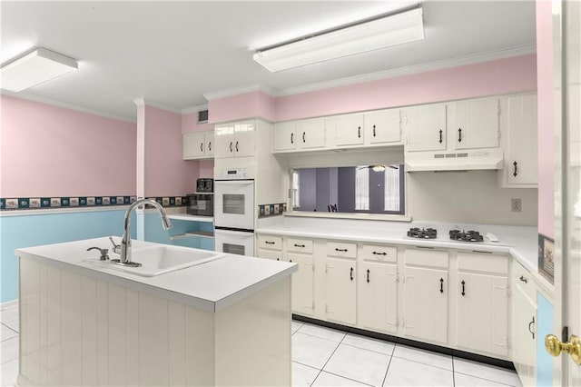 3952 Augusta St, Metairie, LA 70001 - kitchen featuring a sink, under cabinet range hood, light tile patterned flooring, and white appliances