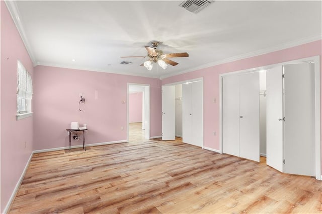3952 Augusta St, Metairie, LA 70001 - unfurnished bedroom with two closets, visible vents, and light wood-style floors