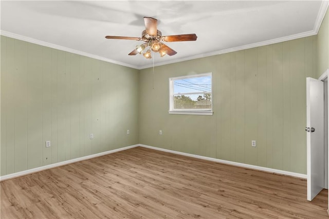 3952 Augusta St, Metairie, LA 70001 - spare room featuring baseboards, ceiling fan, crown molding, and wood finished floors
