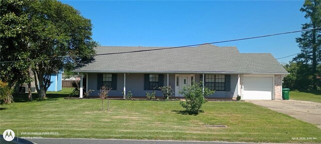 742 Central Ave, Reserve, LA 70084 - view of front facade with a garage, a shingled roof, driveway, and a front lawn