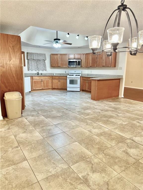 742 Central Ave, Reserve, LA 70084 - kitchen with white appliances, a sink, brown cabinetry, and a textured ceiling