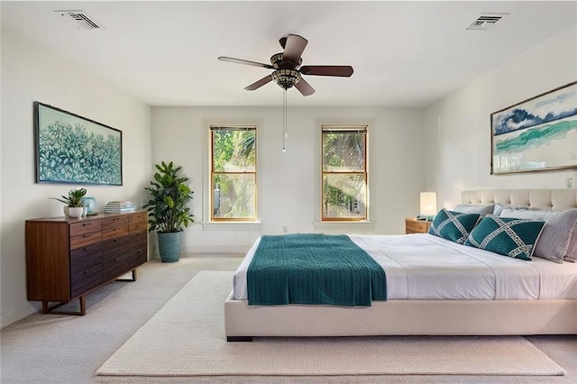 bedroom with baseboards, visible vents, and carpet floors
