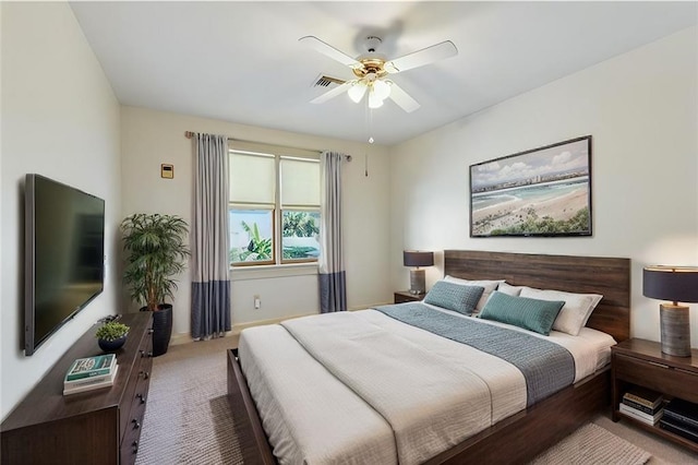 bedroom with visible vents, baseboards, ceiling fan, and carpet